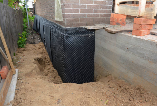 SJ Waterproofing Pros technician performing targeted Waterproofing assessment in Bluffton, OH